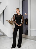 Black jumpsuit with sequinned lace